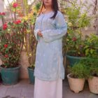 model posing in blue kurta